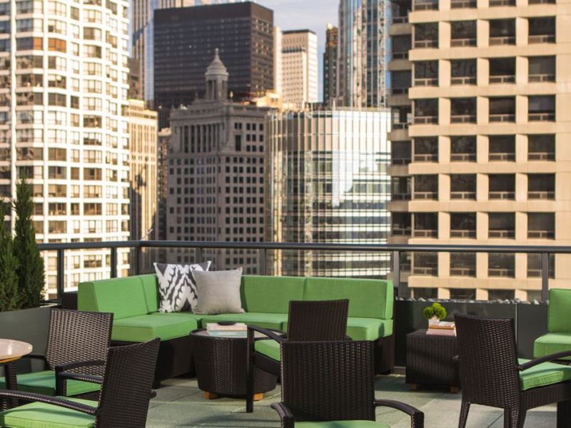 Hotel terrace with chairs and table.