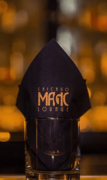 Chicago Magic Lounge exterior showcasing a vibrant sign, inviting guests to experience live magic performances.