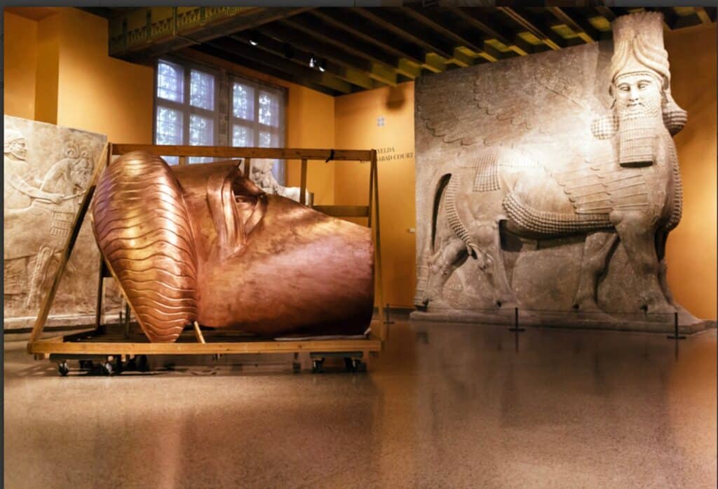 A large horse statue displayed prominently in a museum setting, showcasing intricate details and craftsmanship.
