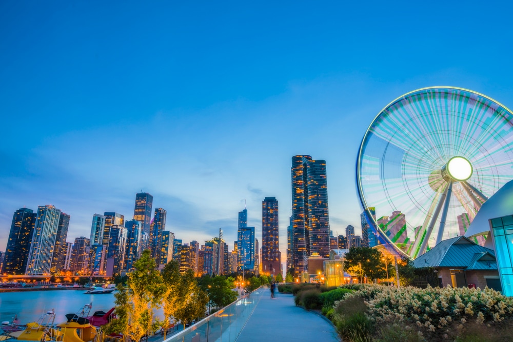 Navy Pier at dusk with a large ferris wheel on the right side.