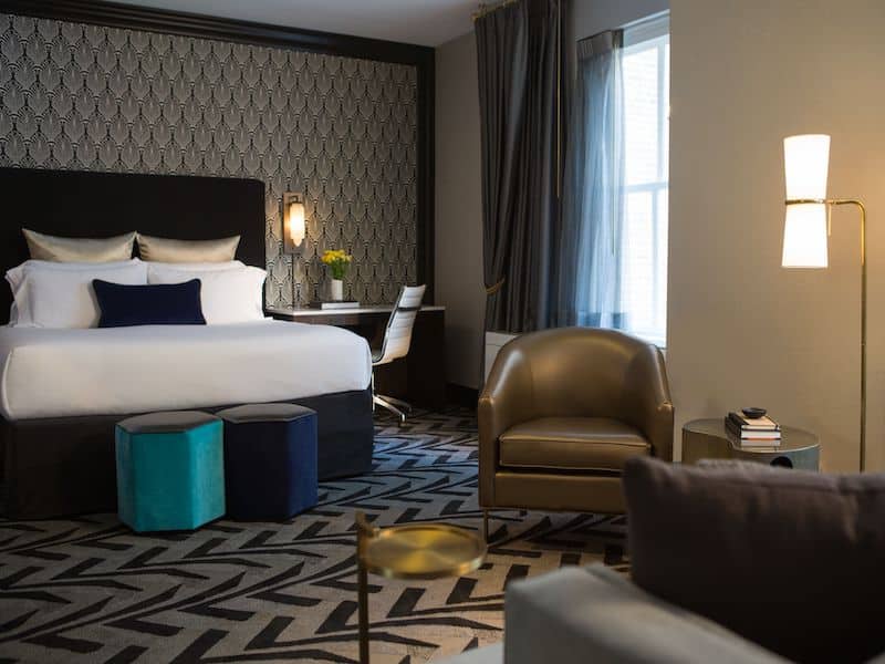 Room with a large bed and ample seating area