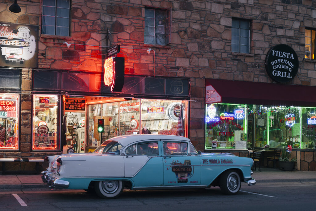 Classic car and neon signs at night in Williams, Arizona 