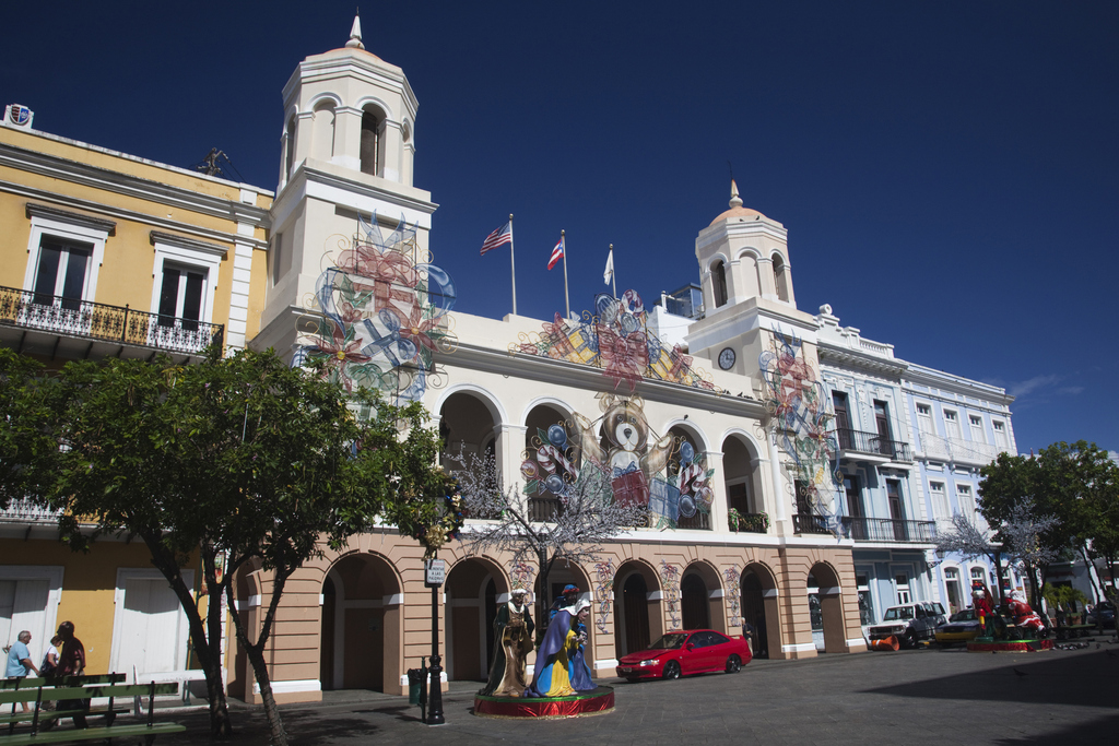 A large building featuring an impressive clock tower prominently displayed at its top.